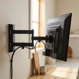 QualGear 13-27 in Full Motion TV Wall Mount, Low Profile, Black in use, lifestyle view